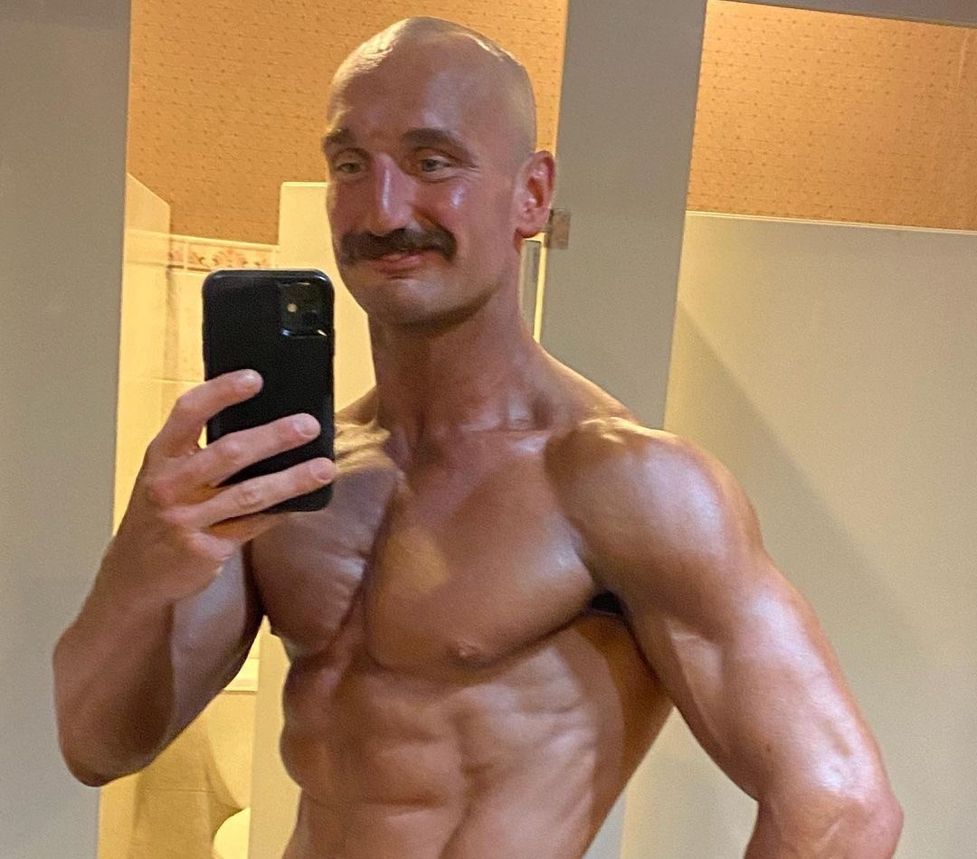 Client achieving elite physique through natural training