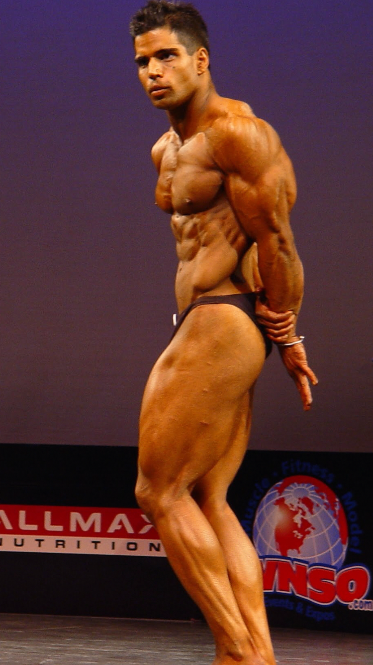 Founder competing as a natural professional bodybuilder on stage