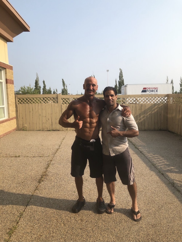 Founder with a client after achieving all-natural transformation